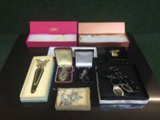 A basket of a sterling silver locket and chain,