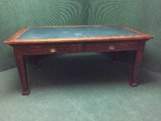 An Edwardian pine two drawer library table,