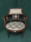 A Victorian inlaid mahogany elbow chair