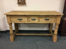 A reclaimed pine three drawer farmhouse table,