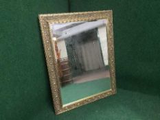 A decorative gilt framed mirror