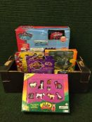 Two boxes of die cast vehicles, football minis, Flintstone figurines,