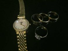 Two 18ct gold band rings (4.2g), a 9ct gold stone set band ring (2.