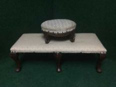 An oval antique footstool and a duet footstool