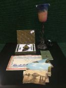 A tin of early twentieth century postcards,