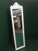 A contemporary cream cheval mirror