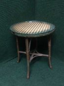 A Lloyd Loom circular table