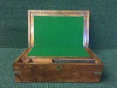 A Victorian walnut brass bound writing box
