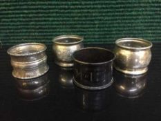 Four sterling silver napkin rings