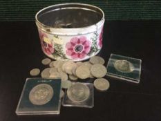 A tin of a collection of crowns and British silver coins