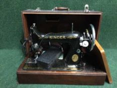 A cased vintage Singer sewing machine