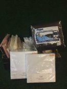 A box of new bedding and a Slanket