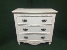 A painted bow fronted three drawer chest