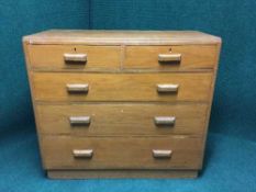 An oak five drawer chest