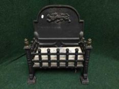 An early twentieth century cast iron fire grate