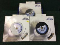 A crate of five diamond cutting blades together with one other