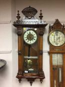 A Victorian inlaid mahogany Vienna wall clock