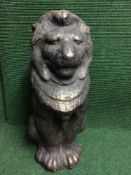 A concrete garden ornament of a lion
