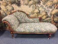 A Victorian walnut chaise longue,