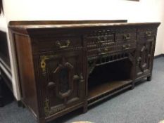 An aesthetic movement oak sideboard,