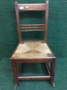 An Edwardian oak rocking chair