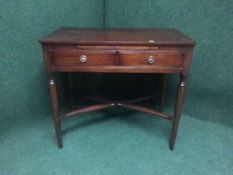 A mahogany hall table fitted with two drawers on reeded legs