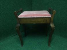 An Edwardian storage piano stool