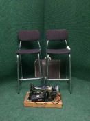 A pair of mid 20th century chrome bar stools and a Singer electric sewing machine