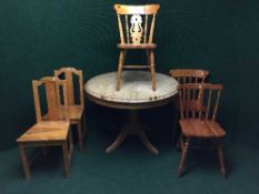 A pine extending table and five miscellaneous chairs