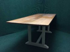 An oak topped refectory table on painted base