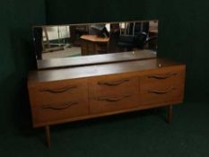 A mid 20th century teak dressing chest
