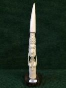 A carved mounted tusk