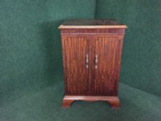 An inlaid mahogany audio cabinet