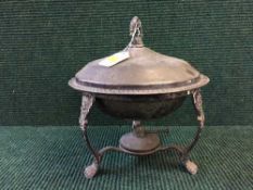 A silver plated food warmer on three way stand