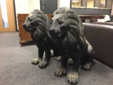 A pair of seated bronze lion figures, height 78 cm.