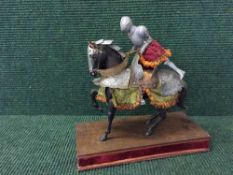 An early 20th century folk art figure of a knight on horseback