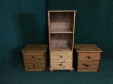 A pine audio cabinet and a pair of bedside stands