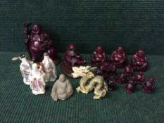 A collection of oriental resin figures - Buddha, dragon,