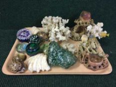 A tray of two soapstone figures, coral, shells,