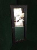 A leather framed mirror