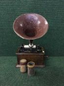 An oak cased Edison phonograph with a quantity of cylinders