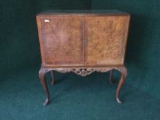 A walnut cocktail cabinet