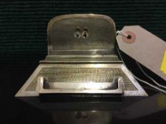 An early 20th century silver mounted desk calendar