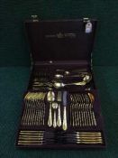A canteen of Solingen cutlery with gilt handles