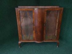 A walnut double door display cabinet