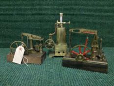 Two miniature live steam piston engines and a boiler
