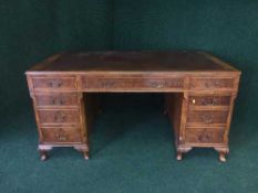 A good quality mahogany twin pedestal desk, with tooled leather top,
