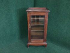 A Victorian mahogany glazed door music cabinet