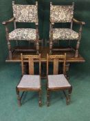 An oak refectory dining table with a pair of tapestry upholstered armchairs and four oak dining