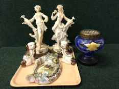 A tray of Staffordshire dogs, pair of continental figures on plinths, vase and cover,